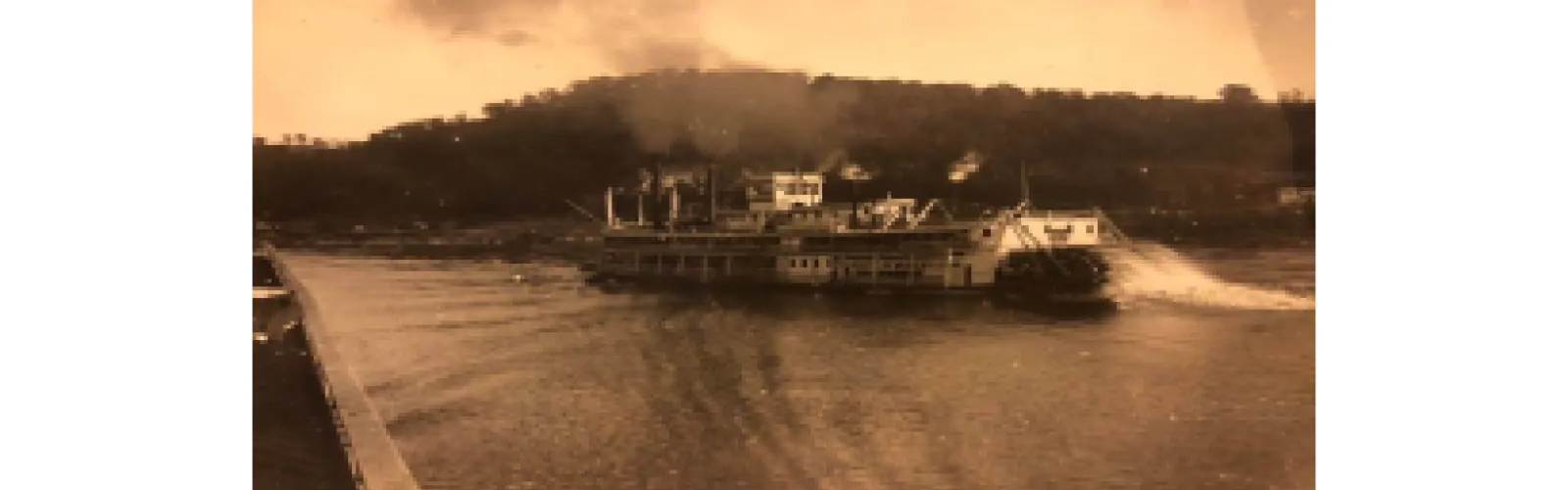 A steamboat traveling up the Ohio River.